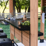 Backyard Discovery Cedar Springs Cedar Wood Outdoor Bar Set with Steel Countertops Shelving and TV Mount Privacy Wall - Image 3