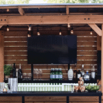 Backyard Discovery Cedar Springs Cedar Wood Outdoor Bar Set with Steel Countertops Shelving and TV Mount Privacy Wall - Image 9