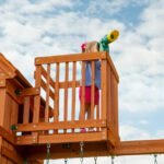 Backyard Discovery Skyfort II Cedar Wood Playset Swing Set with Raised Clubhouse Wave Slide Monkey Bars and Rock Climbing Wall - Image 7